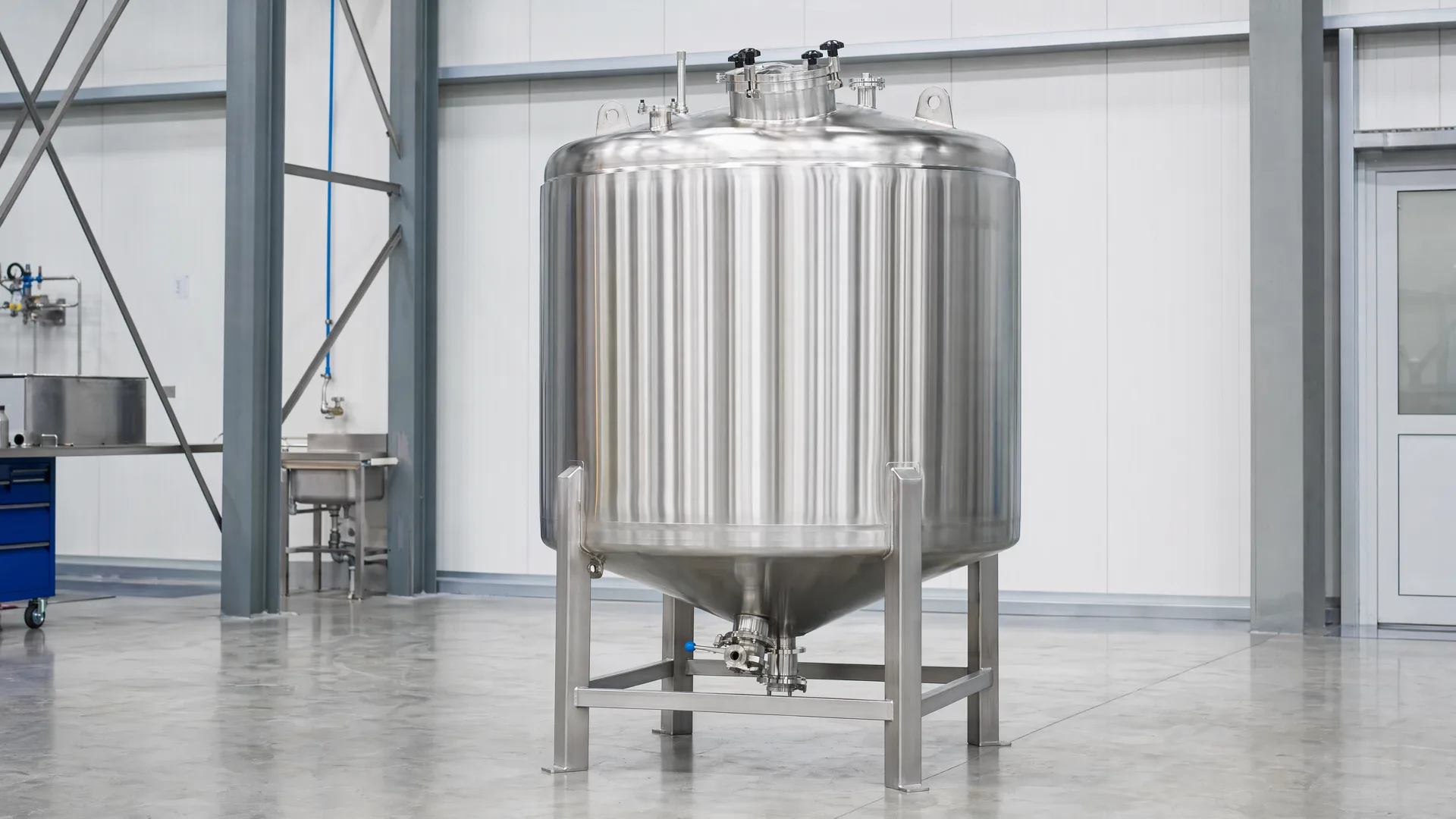 Completed vertical tank representing the end of a drawing-led manufacturing path